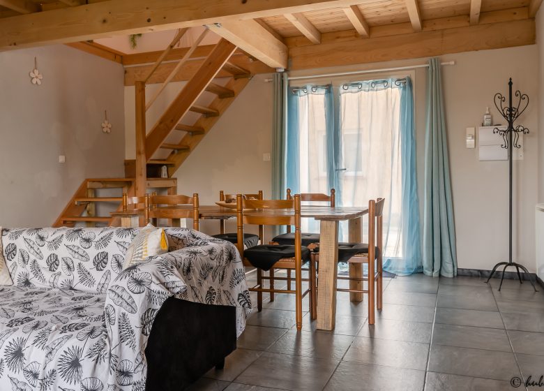 view of dining area and entrance to the cottage